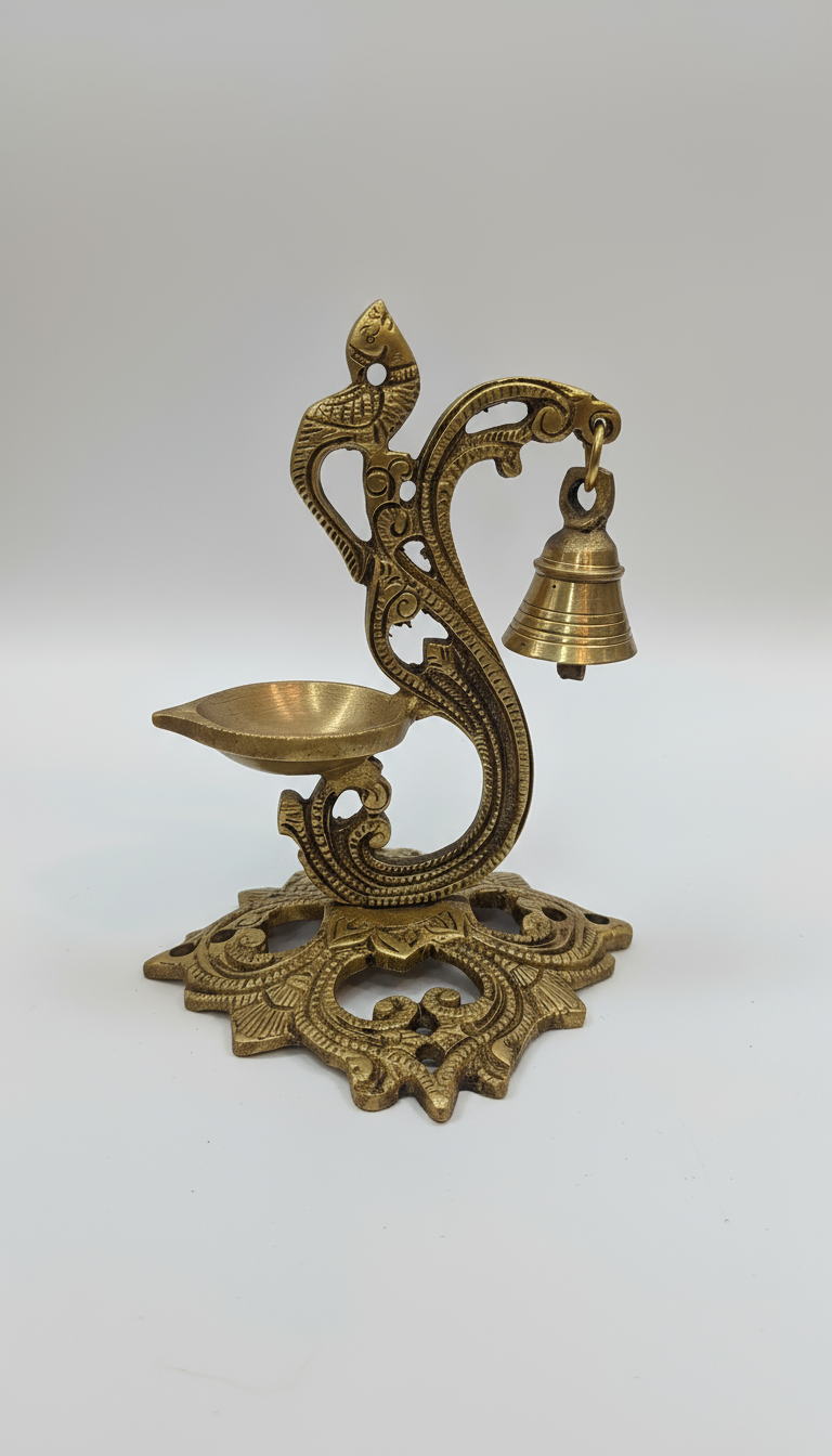 Decorative brass lamp with bell on a white background